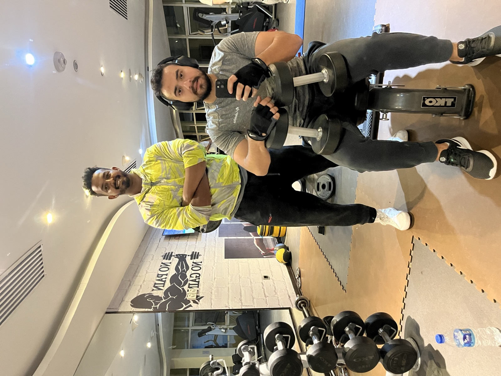 Coach Miki coaching a client through a seated exercise